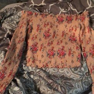 i’m selling a pink flower long sleeved shirt. It’s an xl but fits like a medium